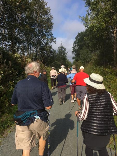 Group of people walking along the Rails to Trails